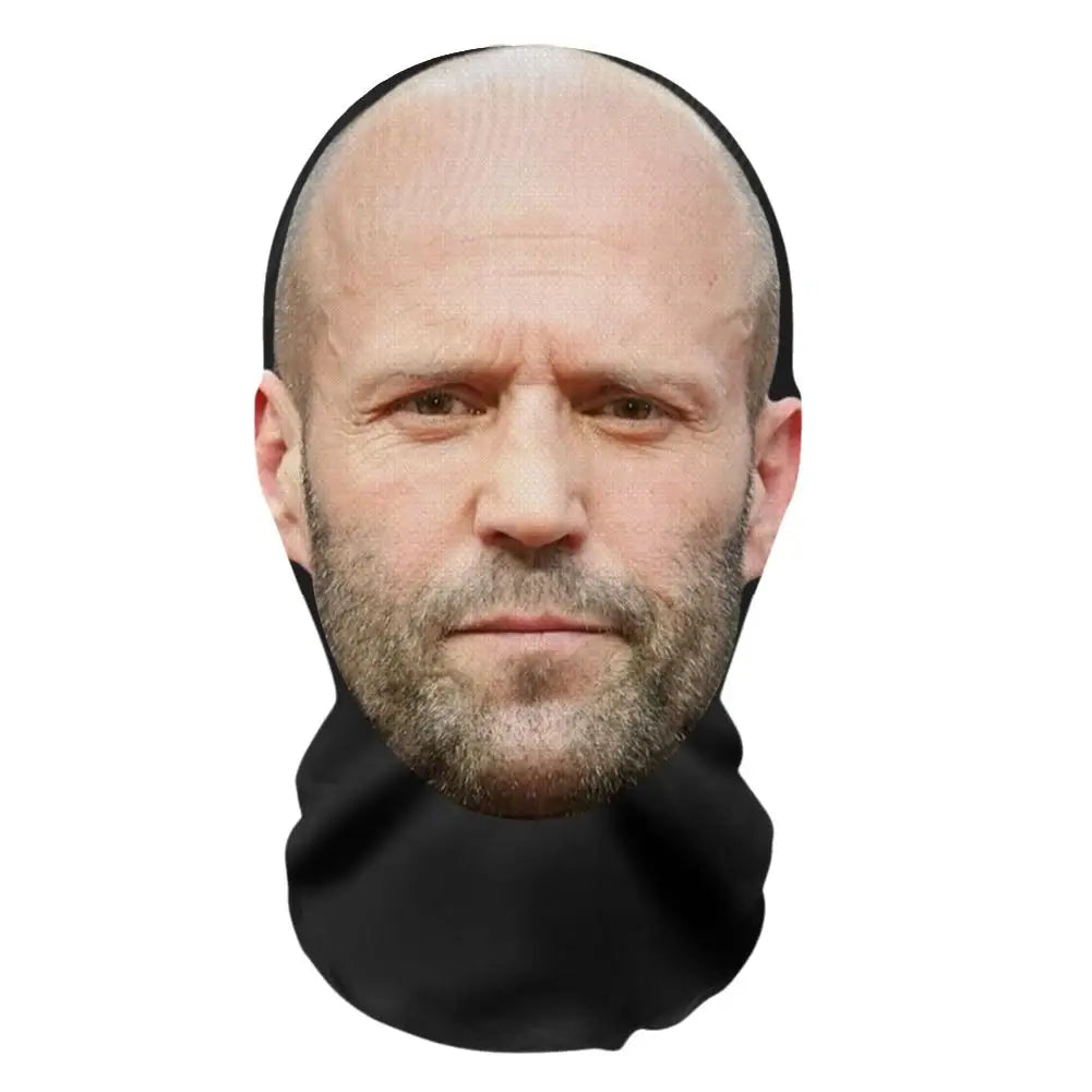 A man with a short beard wearing a black fabric face mask