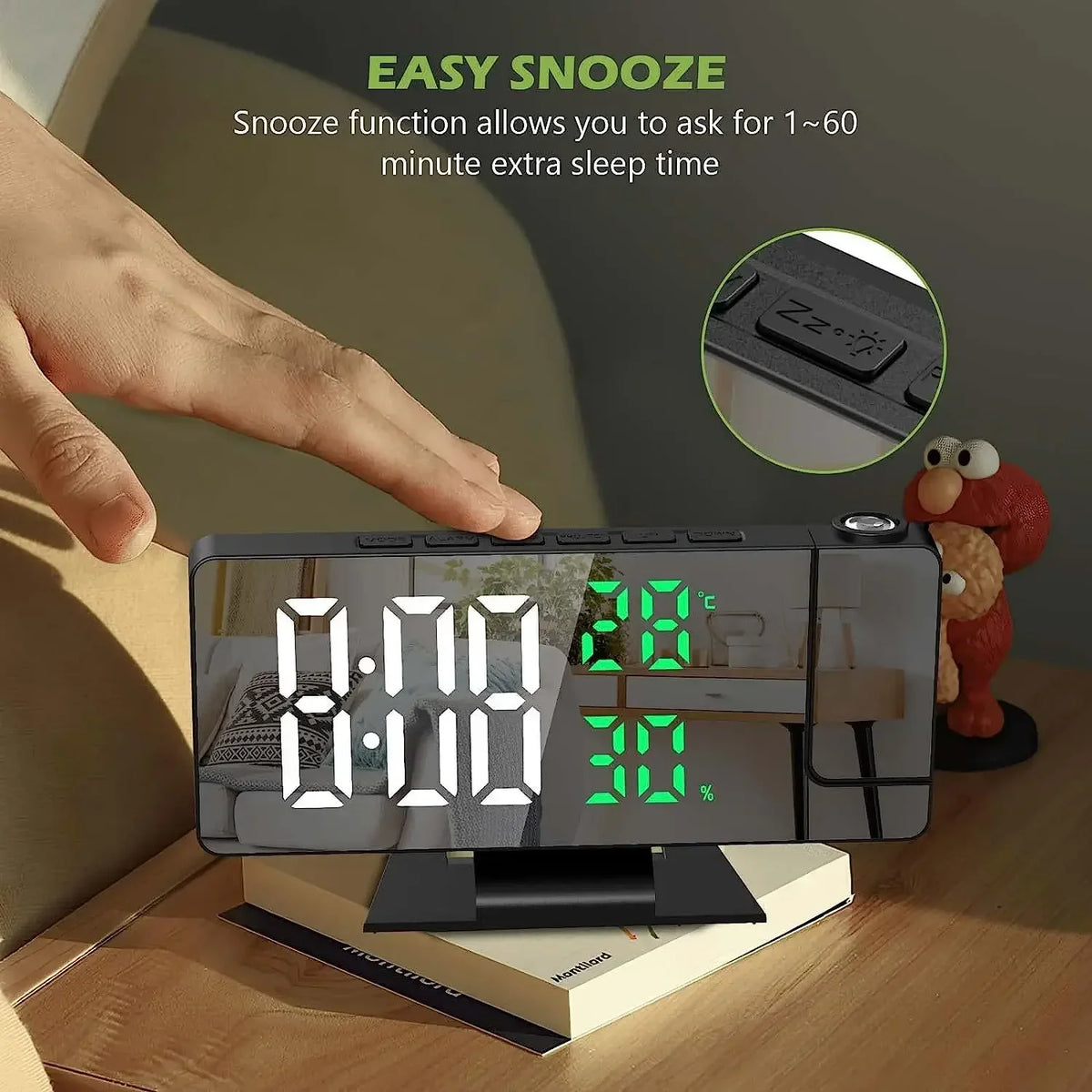 A hand is interacting with an LED digital projection alarm clock displaying 8:00 and a Snooze function feature.