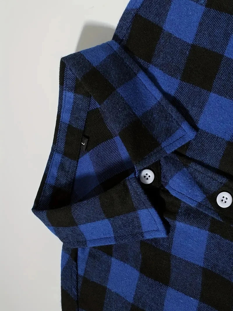 A close-up of a men's blue and black plaid flannel shirt with a collar and button placket.