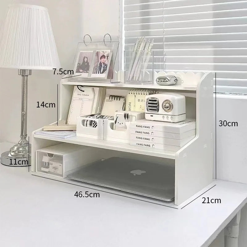 A white two-layer desktop organizer shelf featuring a lamp, stationery, and small appliances.