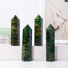 Four dark green emerald crystal point healing wands displayed vertically on a white surface.
