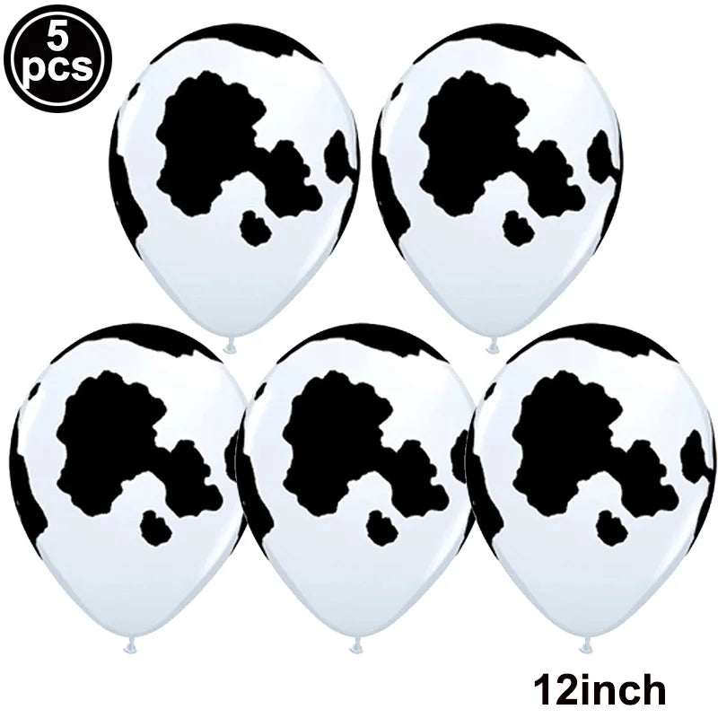 Five white foil balloons featuring a black cow print design for farm-themed parties