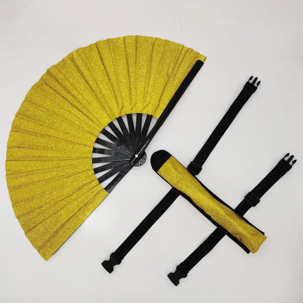 A golden glitter hand fan with a black frame and pleated paper is displayed on a white background.