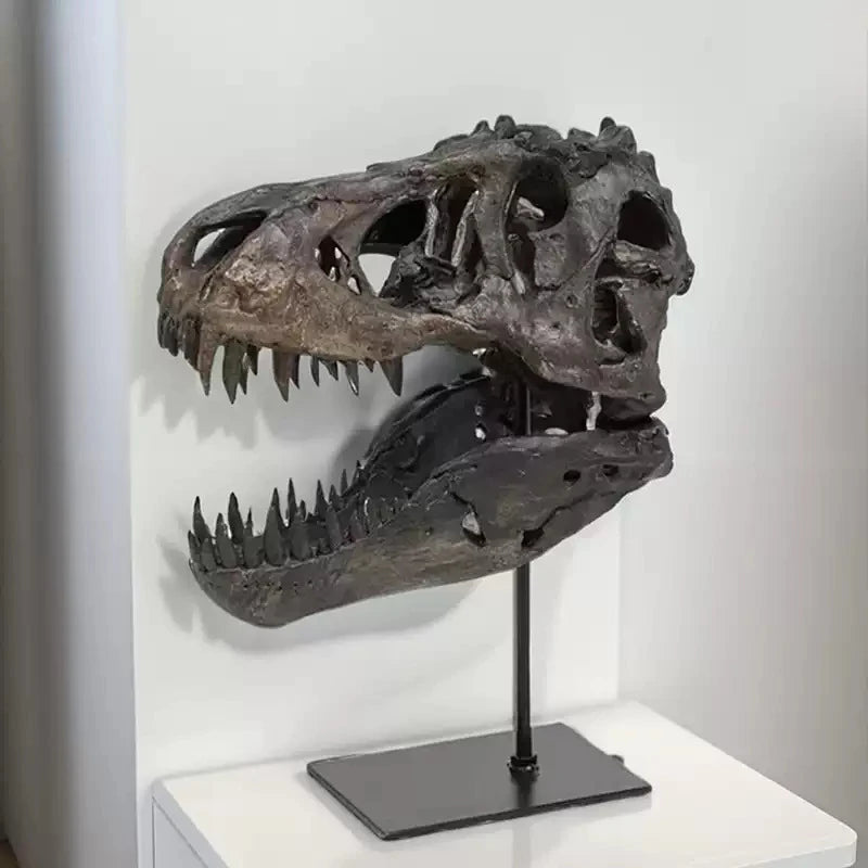 A realistic dinosaur skull resin sculpture displayed on a black stand.