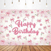 Pink bow tie birthday party backdrop banner featuring pink floral elements and glitter