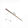 A long, thin metal wand with a pointed tip is shown diagonally against a white background.