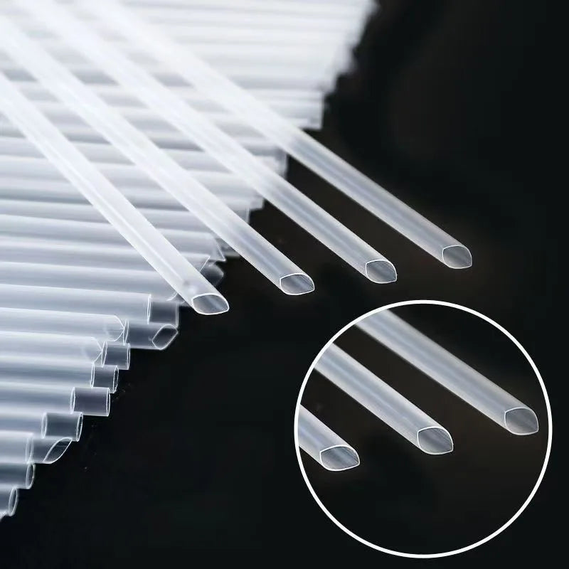 A close-up view of clear disposable drinking straws arranged in a row and a circular inset showing individual straws.