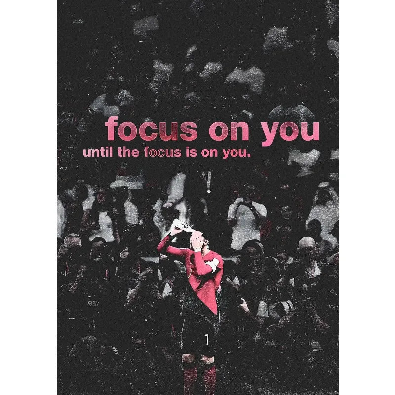 A black and white photo of a football athlete standing on a field with a crowd in the background, featuring the text focus on