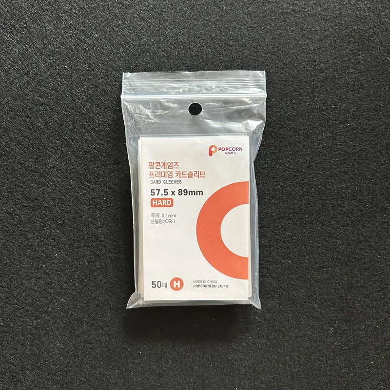 A sealed package of 50 Crystal Clear Protective Card Sleeves for Pokemon cards.