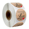 Roll of kraft paper thank you stickers with the words Love and handmade