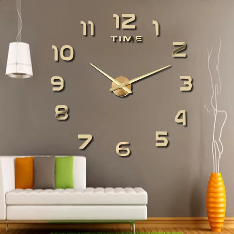 A giant acrylic wall clock with gold numbers and hands mounted on a gray wall above a white sofa.