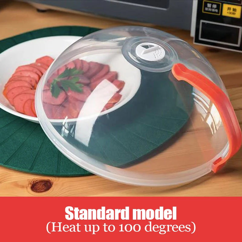 Transparent microwave splatter guard with a green base, clear dome, and orange handle.