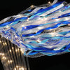 Blue and white LED glow wands with ribbons and bells creating a flowing light effect