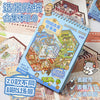 A colorful material book featuring miniature 3D scenes and stickers for kids.