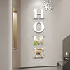 Silver acrylic wall sticker set spelling out HOME with butterfly motifs