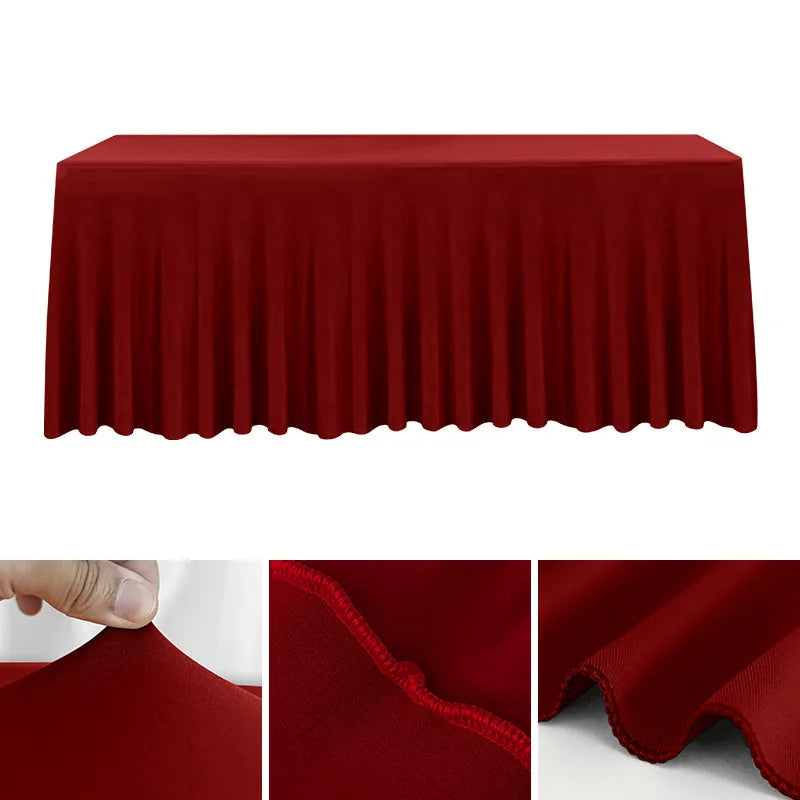 A smooth, deep red stretch rectangle tablecloth draped over a table.