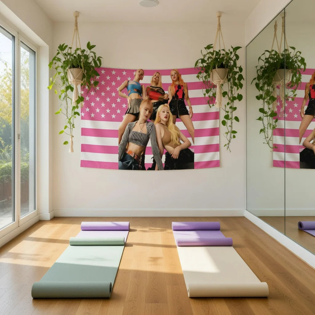 A pink and white striped tapestry featuring five women in K-Pop inspired outfits hangs on a bedroom wall.