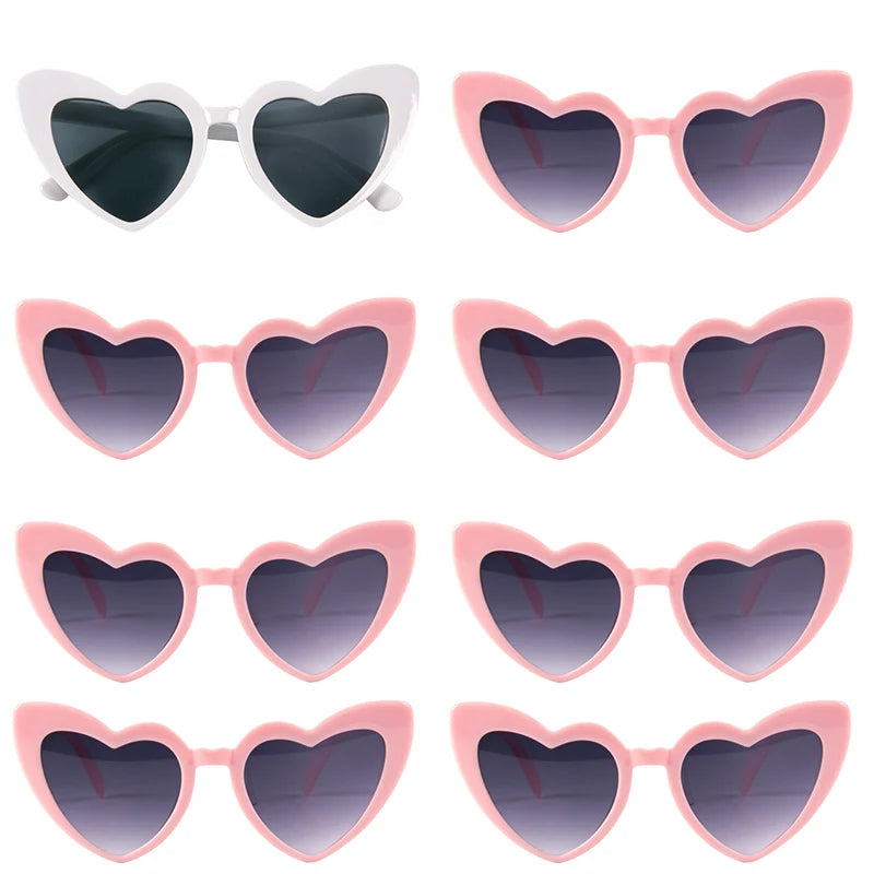 A set of pink and white heart-shaped sunglasses for special events