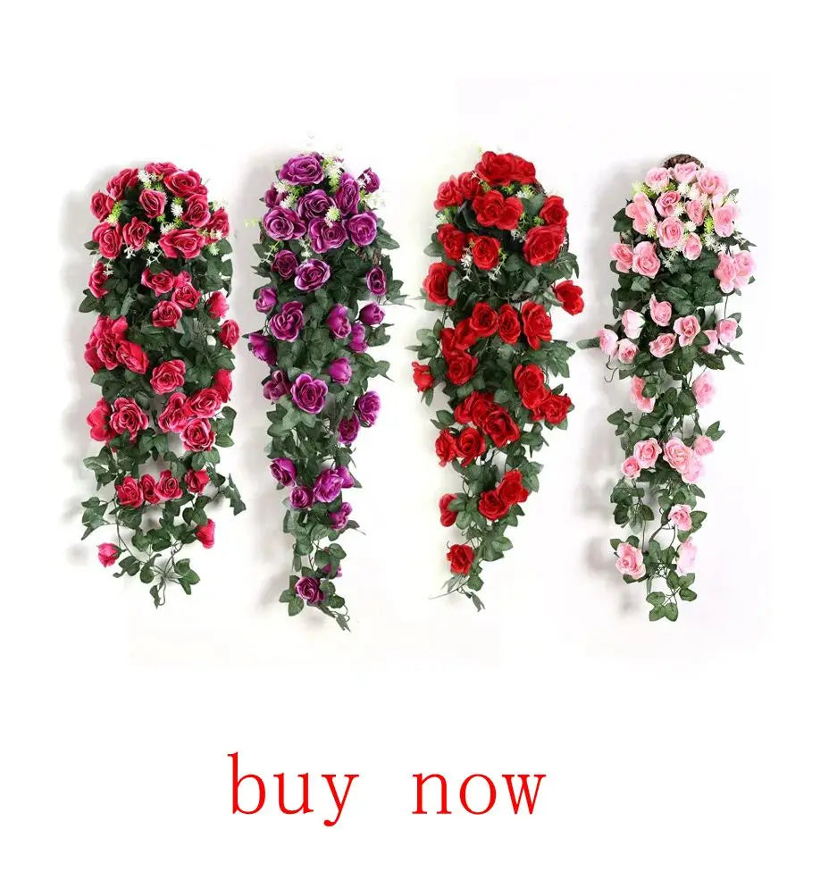 A display of artificial silk rose flowers in shades of red and pink arranged in vertical garlands.