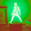 A glowing green light illuminates a 3D football player figure wearing number 7.