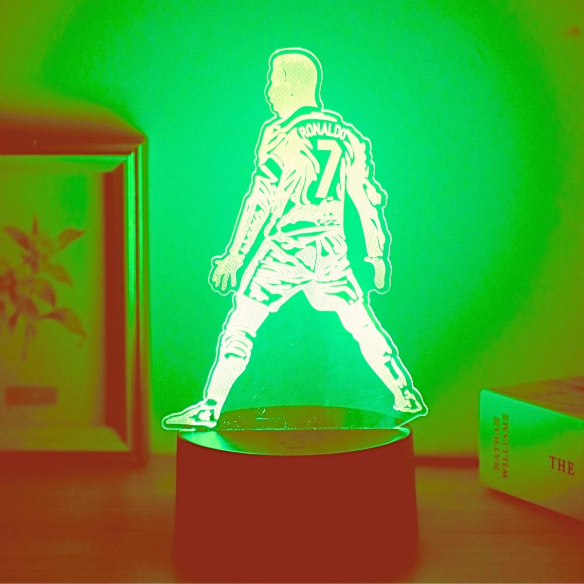 A glowing green light illuminates a 3D football player figure wearing number 7.