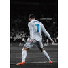 A portrait of a soccer player, Cristiano Ronaldo, in a white jersey and shorts, viewed from behind on a dark field.