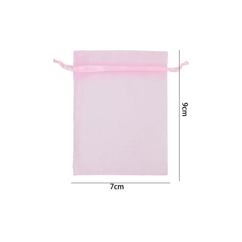 A rectangular pink organza drawstring gift bag with a 9cm height and 7cm width.
