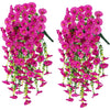 Two bunches of artificial pink morning glory flowers with green eucalyptus leaves used for hanging decor