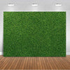 A vibrant green artificial grass backdrop used for party decor and photography.