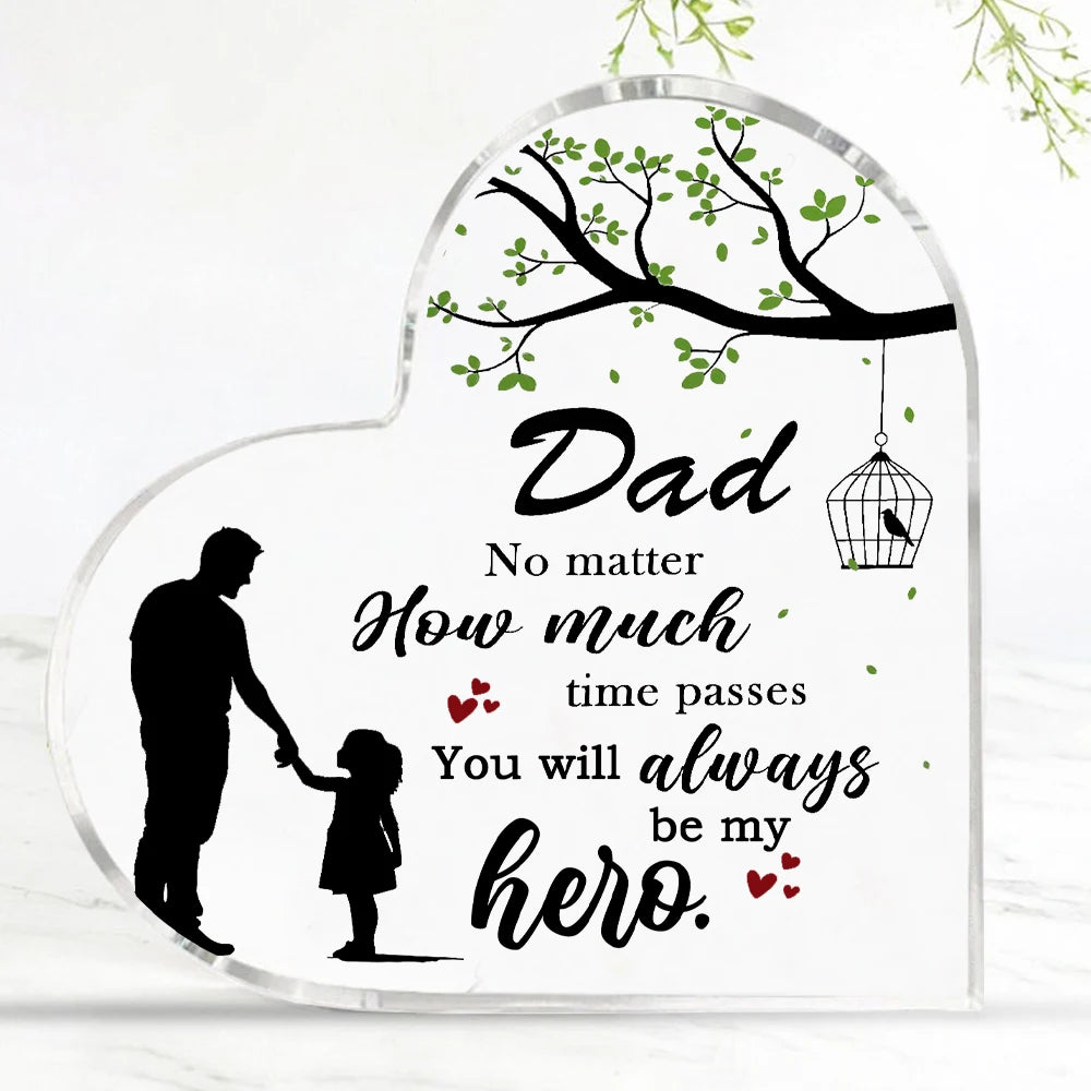 A clear acrylic heart-shaped plaque featuring a silhouette of a father and child, with text that reads Dad No matter how much