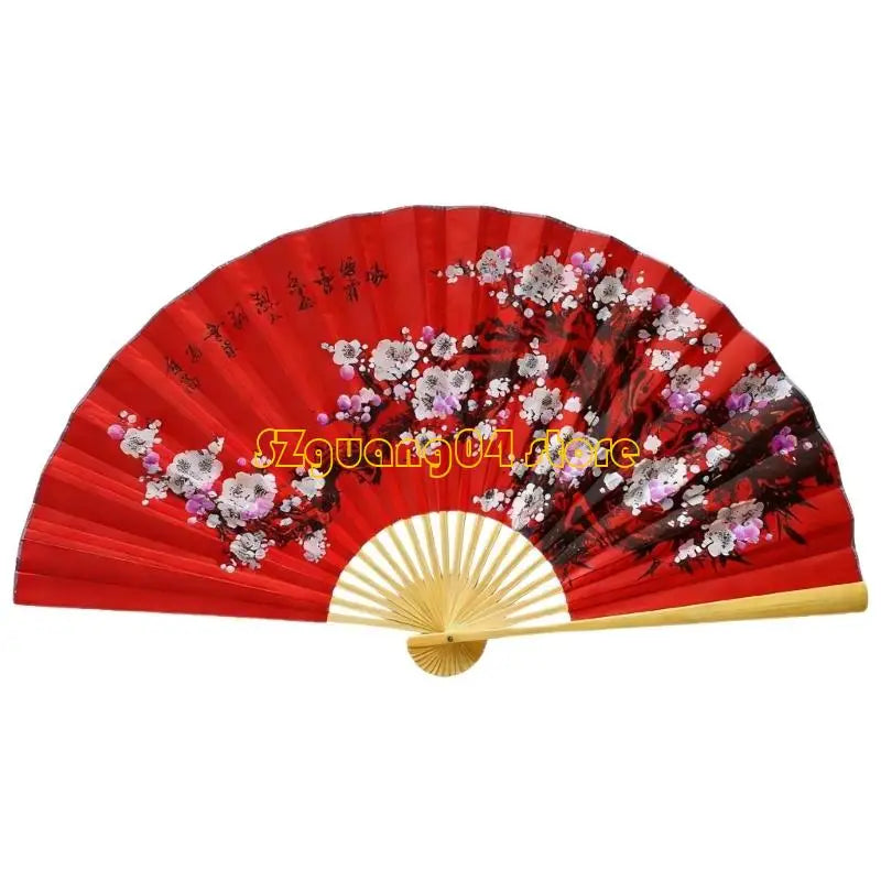 A large decorative red Chinese theme hand fan with floral patterns.