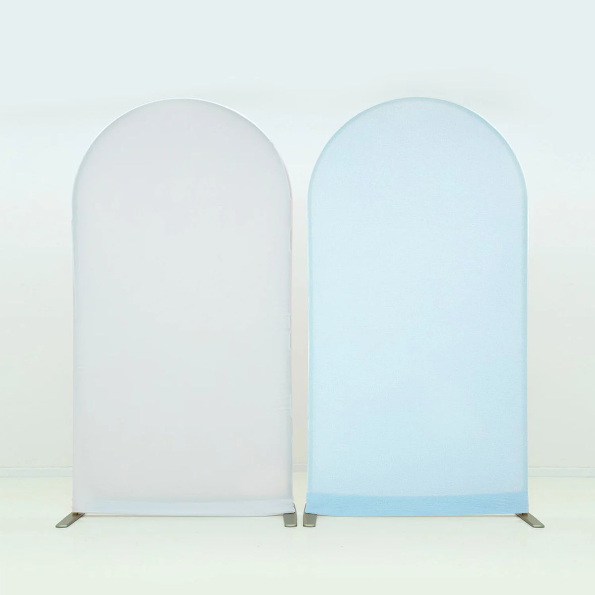 A pair of stretchable arch backdrop covers in white and light blue.