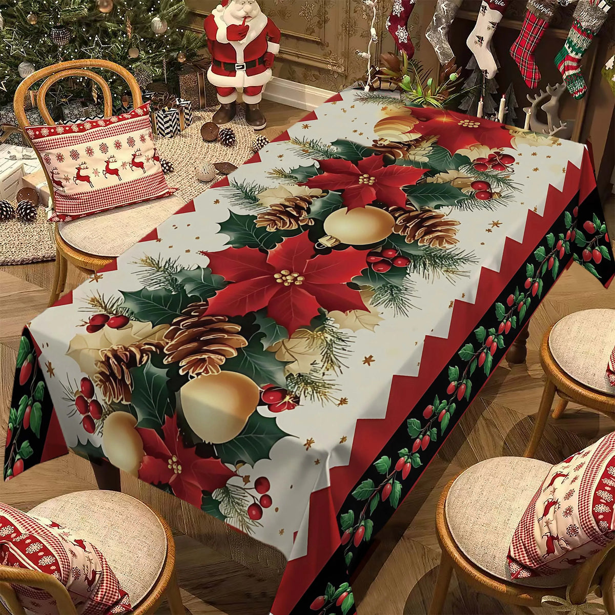 A red and green Christmas poinsettia rectangle tablecloth spread on a wooden table with festive holiday decorations.