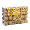 A clear box filled with a set of gold glitter Christmas ornaments and a star tree topper.