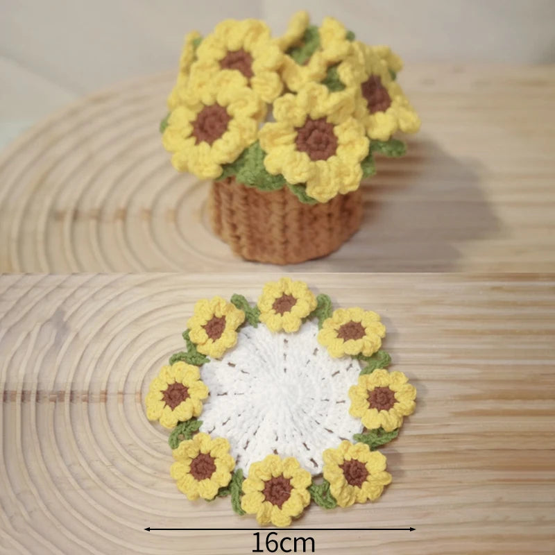 Hand-crocheted yellow and green rose flower coasters displayed on a wooden surface.