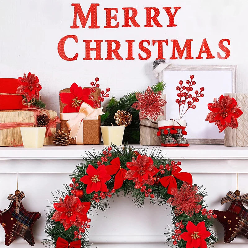 A festive arrangement of red artificial Christmas flowers and greenery displayed on a white mantelpiece.