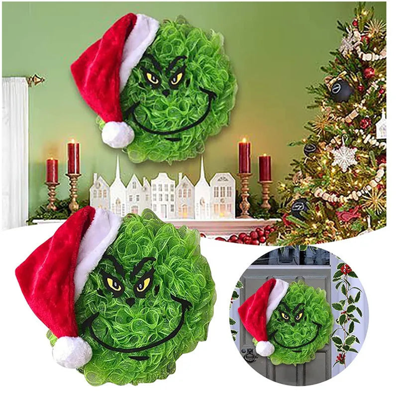 Green monster Christmas wall decor featuring a festive face and a Santa hat
