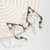 Silver elf flower leaf clip earrings displayed on a light background.