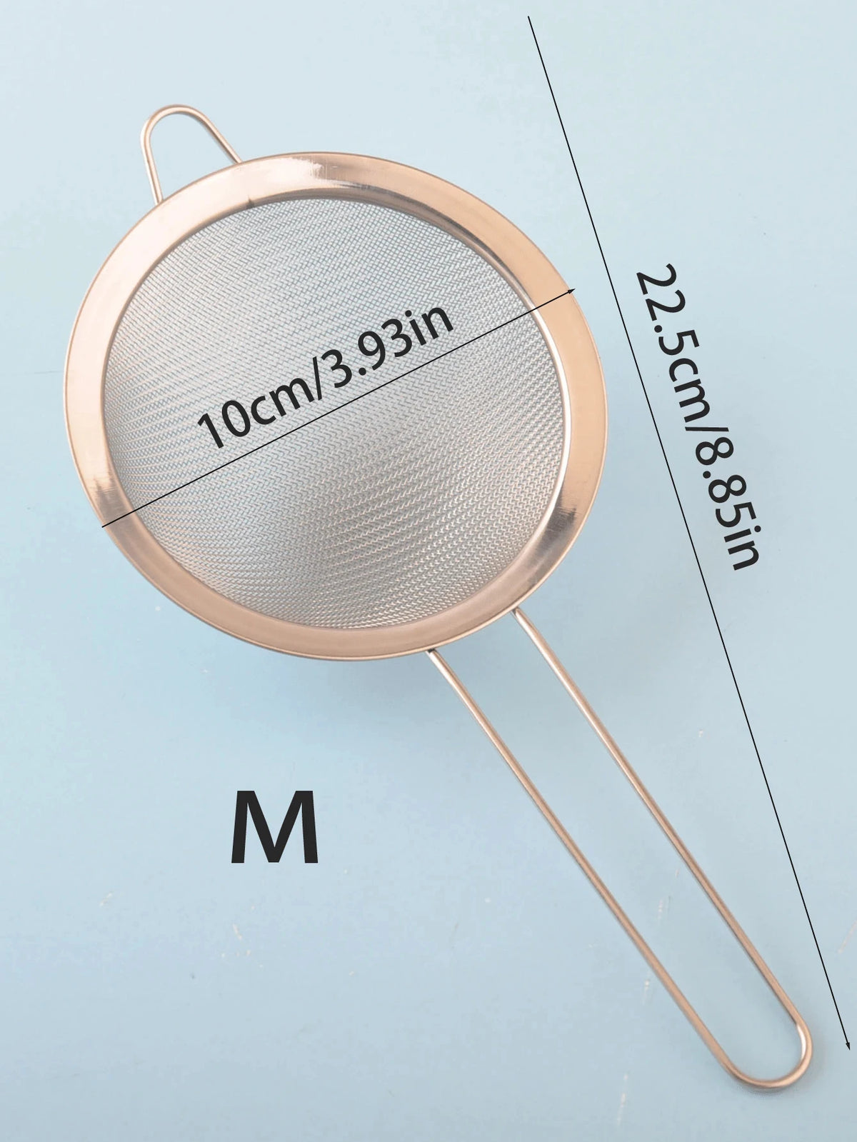 A round stainless steel colander with a 10cm diameter and a handle, shown against a light blue background.