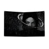 Black and white wall art featuring a silhouette of a person with a glowing ring against a starry background