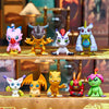 A collection of Digimon Adventure figures featuring various monster designs in vibrant colors and poses.