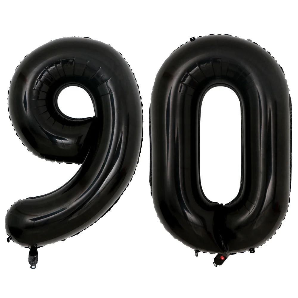 A set of two giant black foil balloons shaped like the number 90