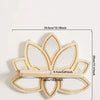 A decorative wooden lotus floating shelf with a mirrored design and natural wood finish.