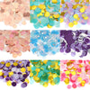 A collection of round tissue paper confetti dots in various pastel and vibrant colors like pink, yellow, blue, purple, and gr