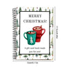 A spiral-bound book featuring a festive Christmas card with a red mug and holiday greeting