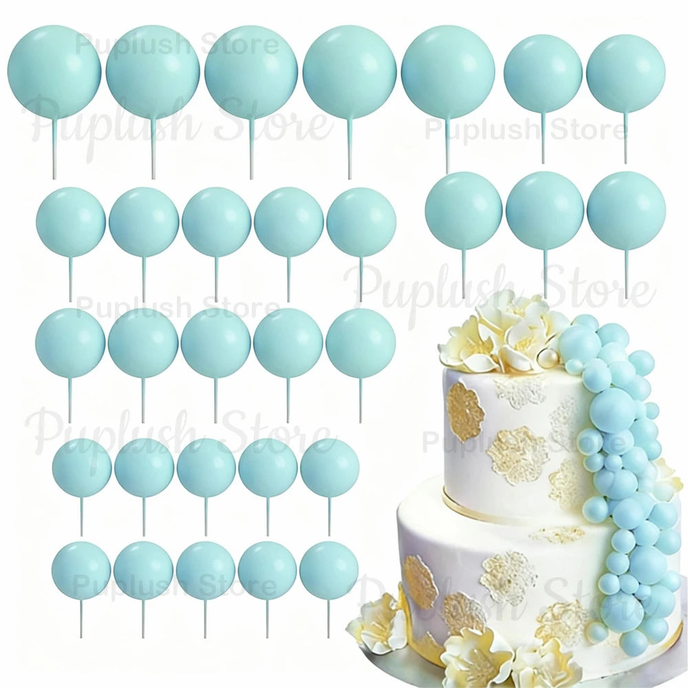 A set of light blue foam cake toppers on sticks, arranged in various sizes and shapes.
