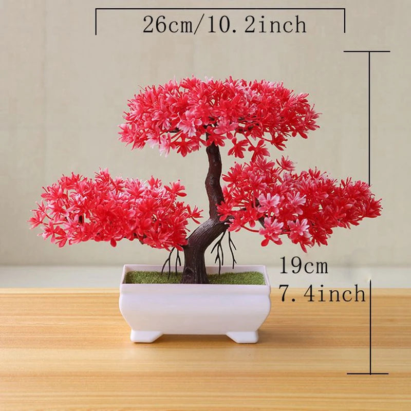A vibrant red artificial tree bonsai decoration with pink blossoms planted in a white rectangular pot.