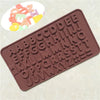 A silicone mold set shaped like letters and numbers in a brown color for baking