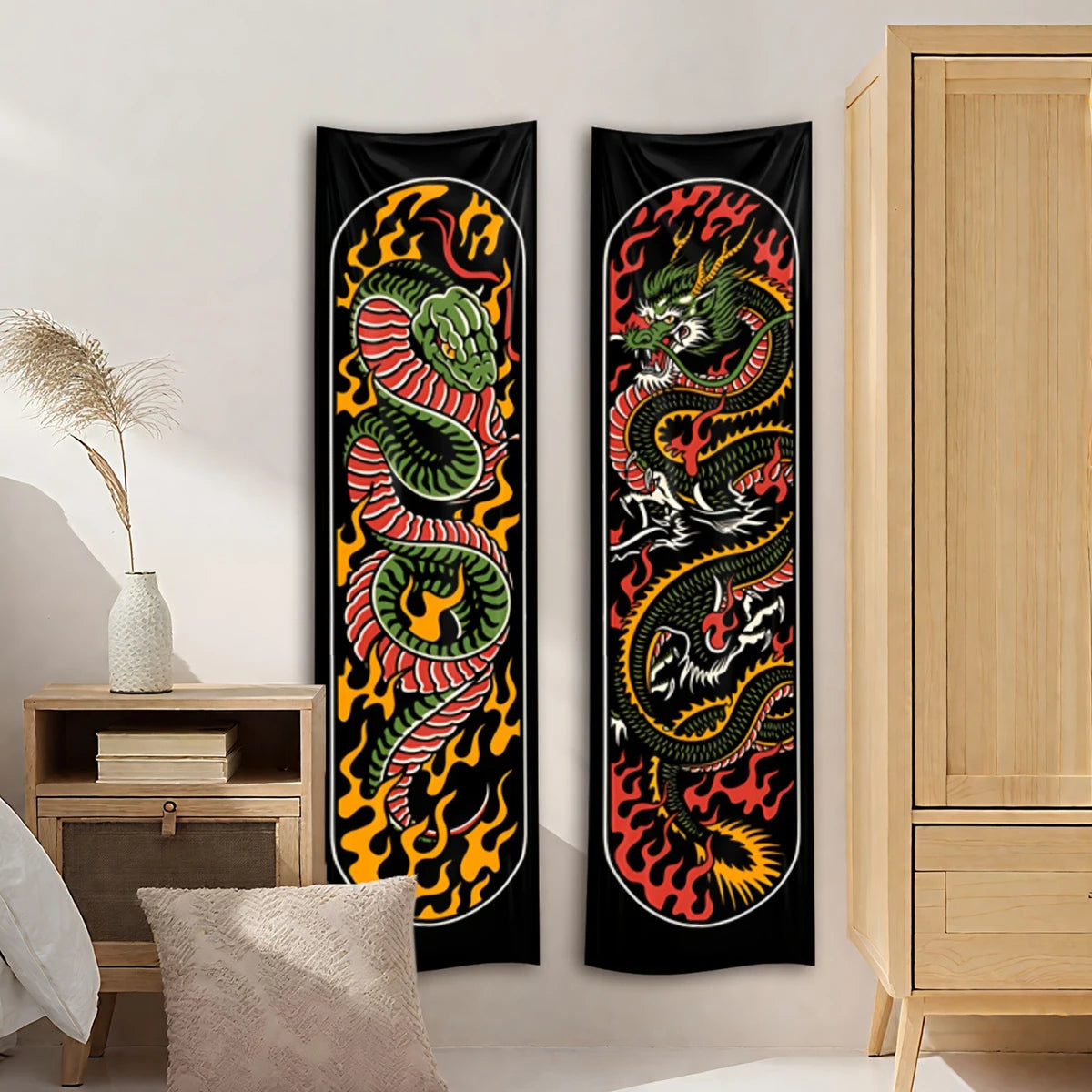 Black flame serpent vertical tapestry wall hanging displayed on a white wall next to a wooden cabinet.