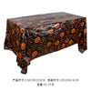 Black Halloween tablecloth featuring an orange pumpkin, spider web, and bat print design.